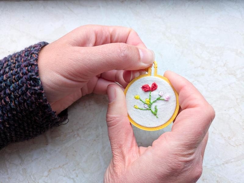 Mini embroidery hoop necklace with closed back