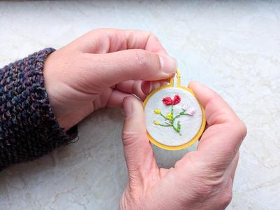 Mini embroidery hoop necklace with closed back