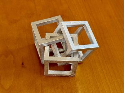 Water-soluble mold for cast-metal Linked Cubes
