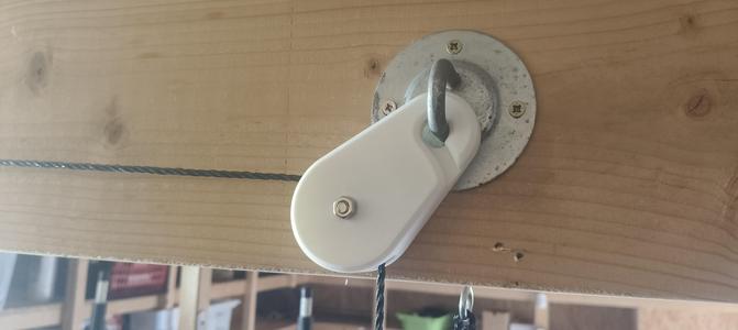 Pulley and integrated hook