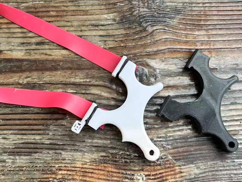 Compact slingshot with anti-slip texture and sight