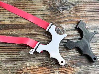 Compact slingshot with anti-slip texture and sight