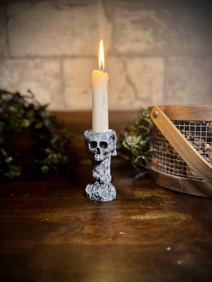 Skull and stone candlestick holder