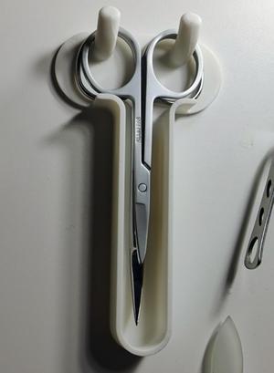 Nail scissor wall mount