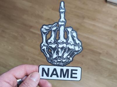 Skeleton hand making a peineta—your name