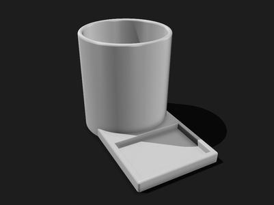 Pen cup with storage tray