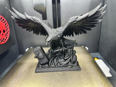 Eagle grasping Thor's hammer statue