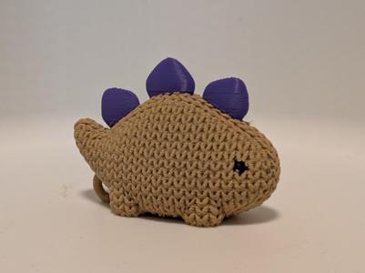 Cute knitted baby Stegosaurus dinosaur